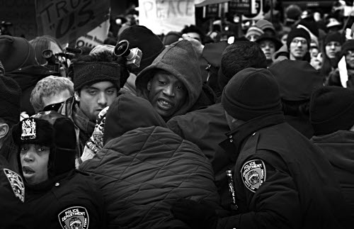 View through police lines, anti-Iraq war demonstration, by Jonathan Sa'adah